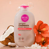 eos shea butter cashmere body wash bottle with coconut and flower on a beige background