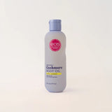 Bottle of EOS Cashmere Body Oil on a white background