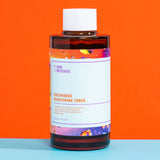 Bottle of Good molecules niacinamide brightening toner with colorful label on an orange and blue background