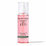 A 200ml clear bottle of Skin By Zaron Acne Control Glow Face Wash containing pink liquid, with a white pump dispenser, set against a plain white background.