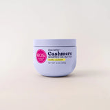 A 12 oz jar of EOS Cashmere Whipped Oil Butter in vanilla cashmere, featuring a light lavender-purple container with a pink circular logo and black text, set against a clean off-white background.